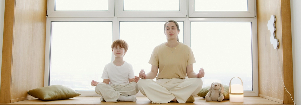 Kid and mother practising mindfulness