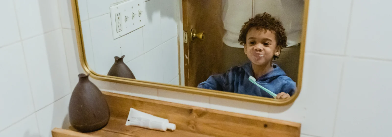 Kid brushing teeth before bedtime